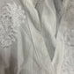 Robe longue brodée blanche défectueuse